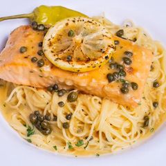 Salmon piccata with capers over pasta at Sami's on Marco Island